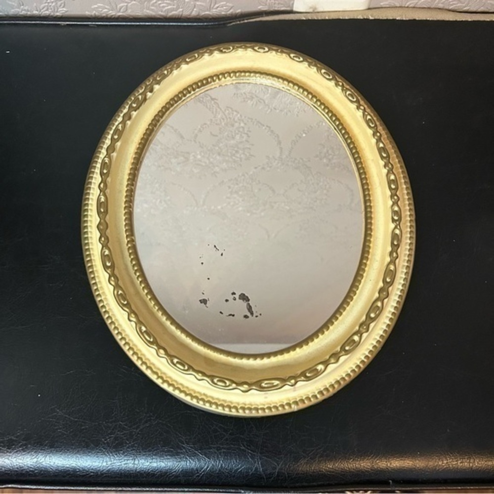 Vintage lightweight mirror with gold cream frame very good condition